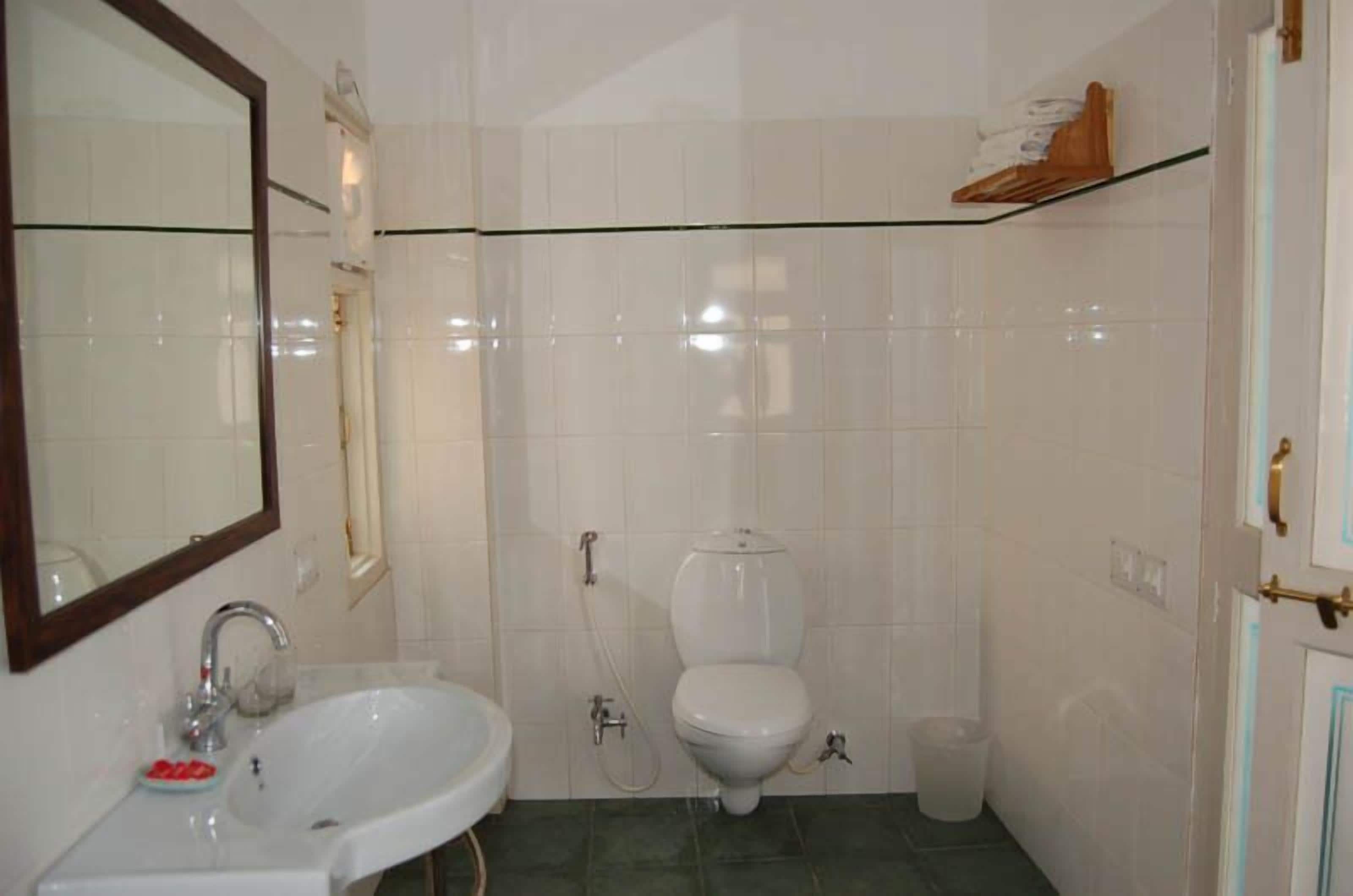 shower, rainfall showerhead, hair dryer, towels