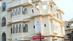 A multi-story building with traditional architectural features, including arched windows and decorative elements.