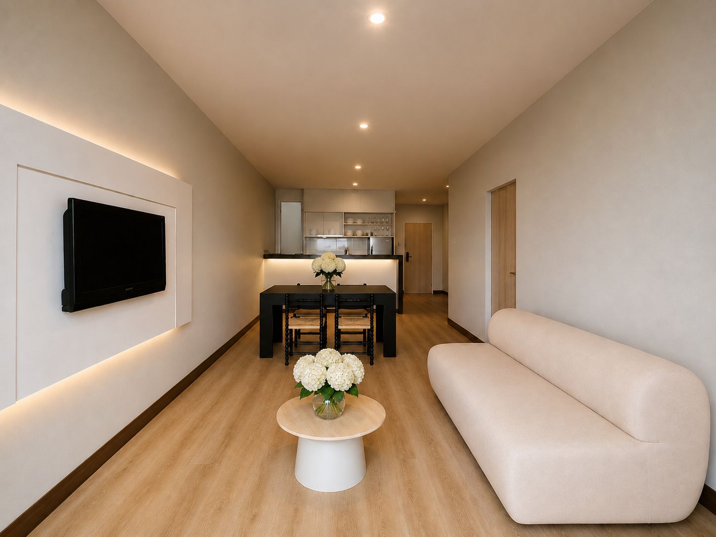 A modern living room with a flat-screen TV mounted on the wall, a dining area with a table and chairs, and a sofa.