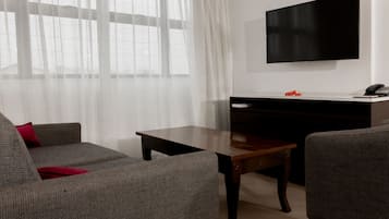 Two-Bedroom Apartment | Living area | 42-inch Smart TV with satellite channels, TV