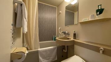 Combined shower/tub, free toiletries, hair dryer, slippers