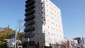 A multi-story hotel with a sign indicating it is part of the Route Inn group. - Hotel Route-Inn Ueda - Route 18 (Ueda)