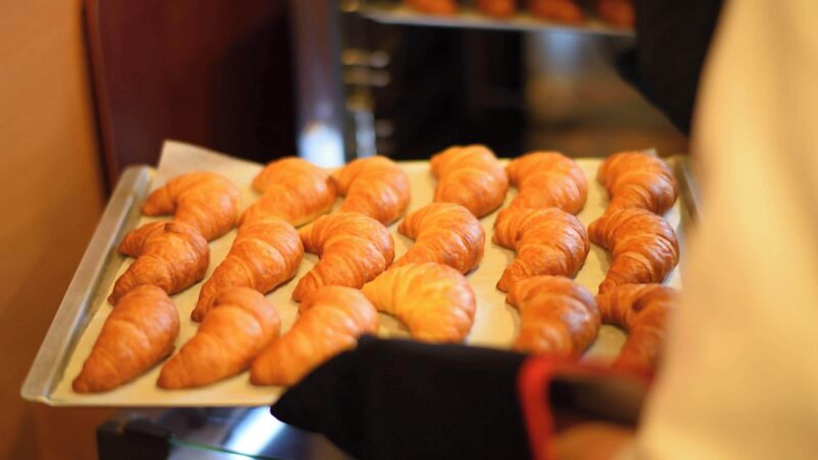 A tray of freshly baked croissants.