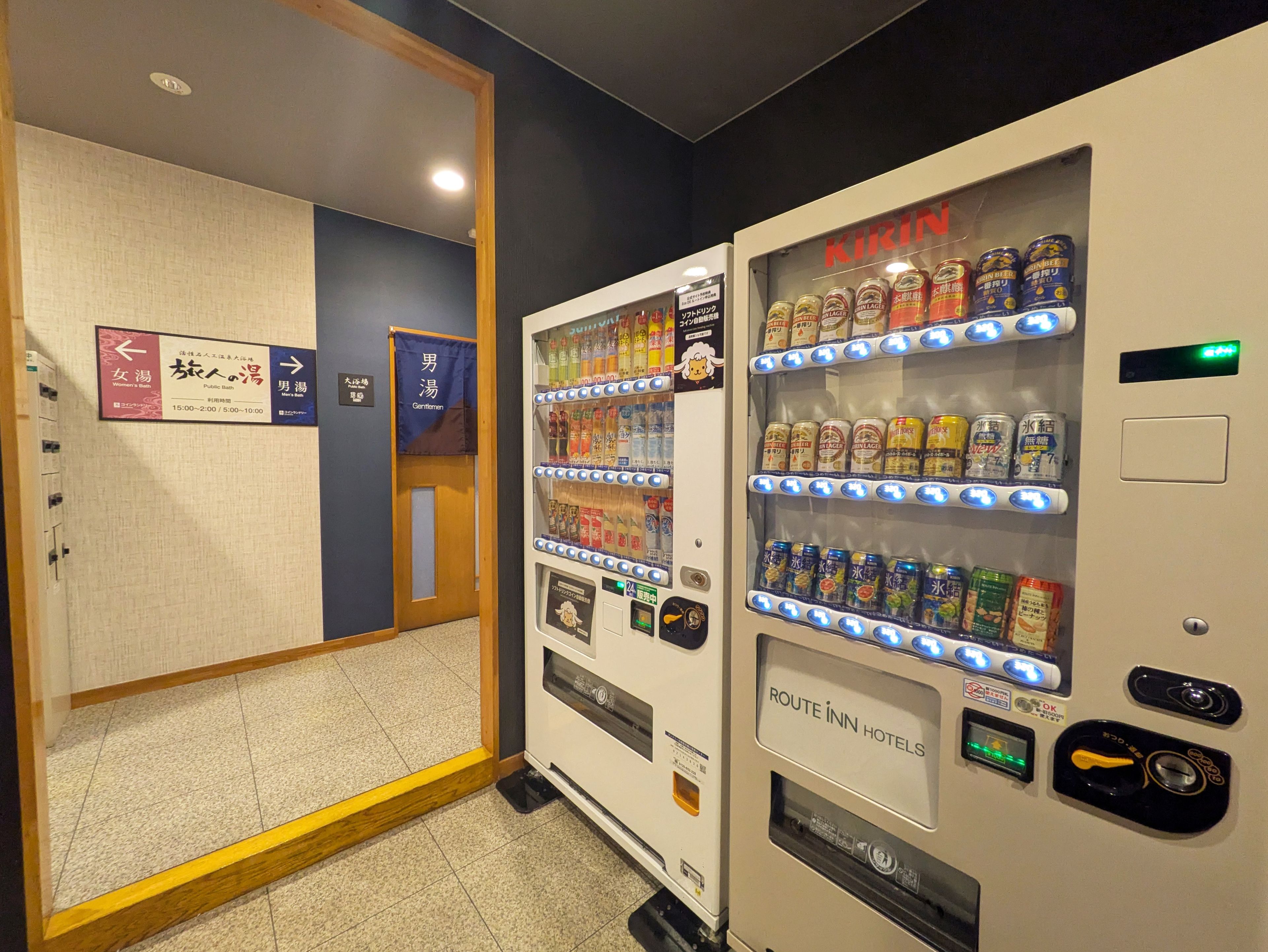 A vending machine with various beverage cans and a sign for 'KIRIN' beer.