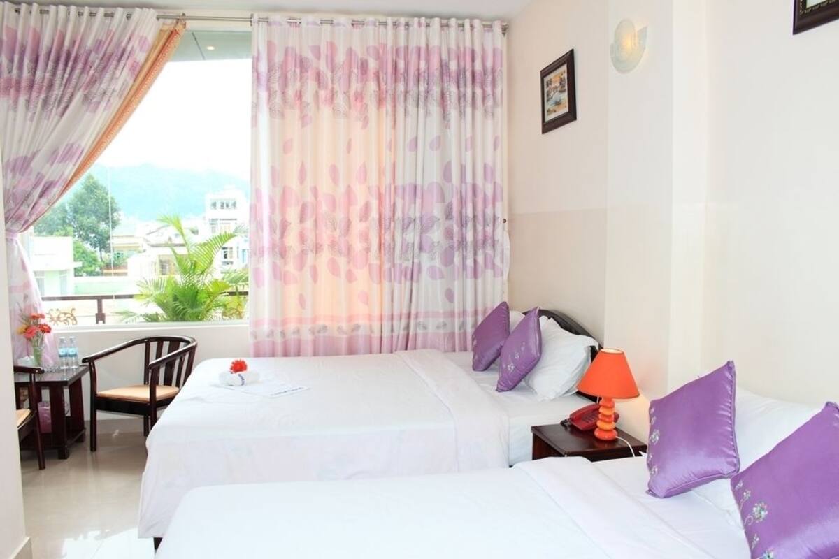 Deluxe Quadruple Room | Minibar, desk, blackout curtains, iron/ironing board (on request)