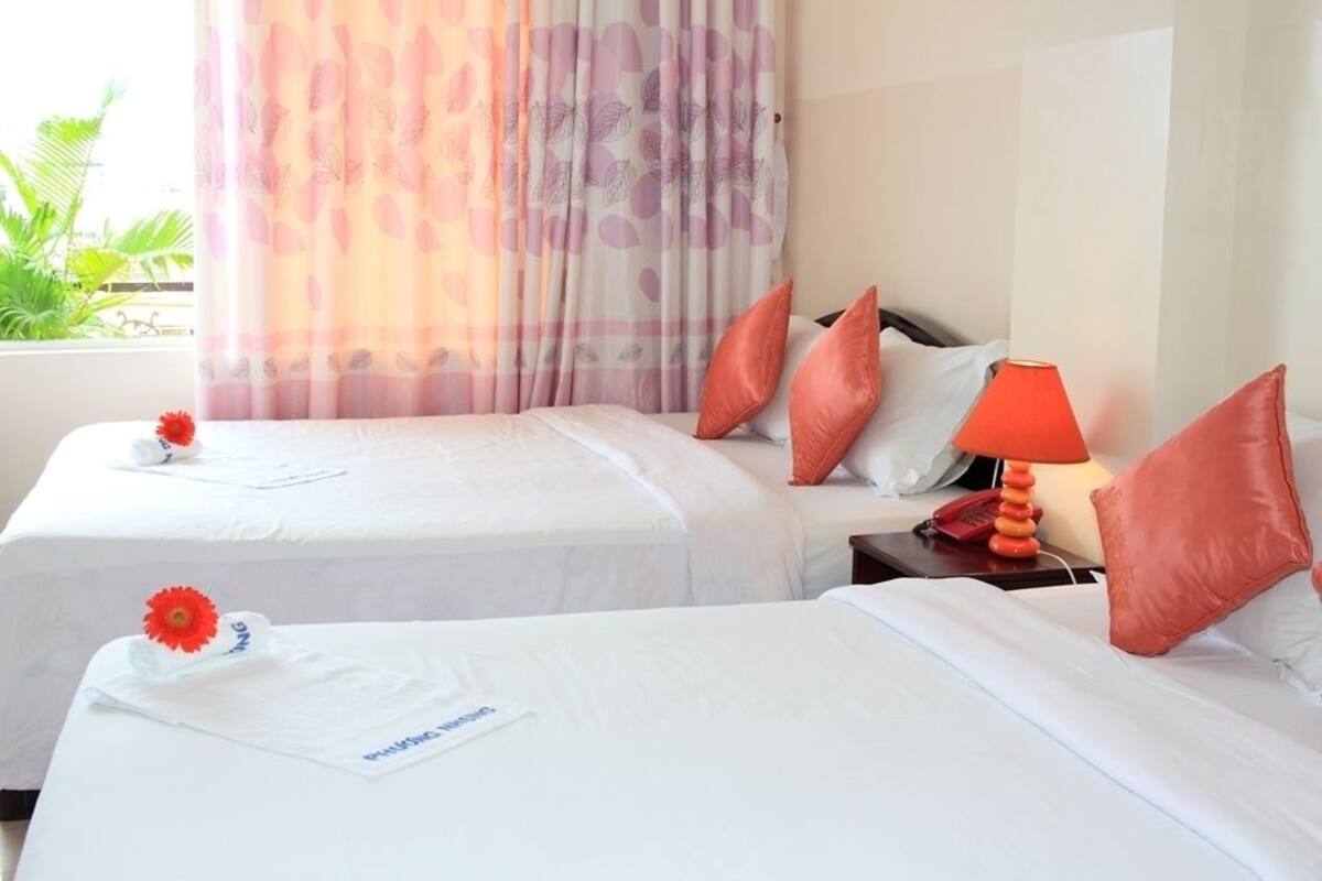 Deluxe Triple Room | Minibar, desk, blackout curtains, iron/ironing board (on request)