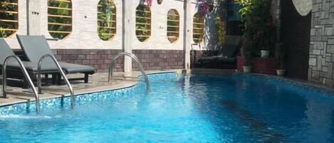 Outdoor pool, open 8:30 AM to 8:30 PM, pool loungers