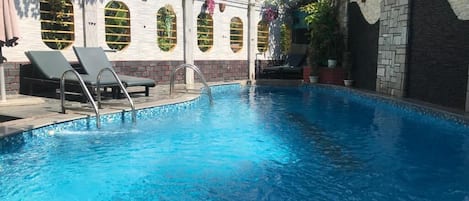 Outdoor pool, open 8:30 AM to 8:30 PM, sun loungers