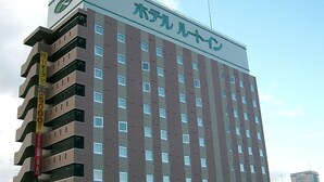 A multi-story hotel building with a prominent sign at the top. - Hotel Route Inn Aizuwakamatsu (Aizuwakamatsu)