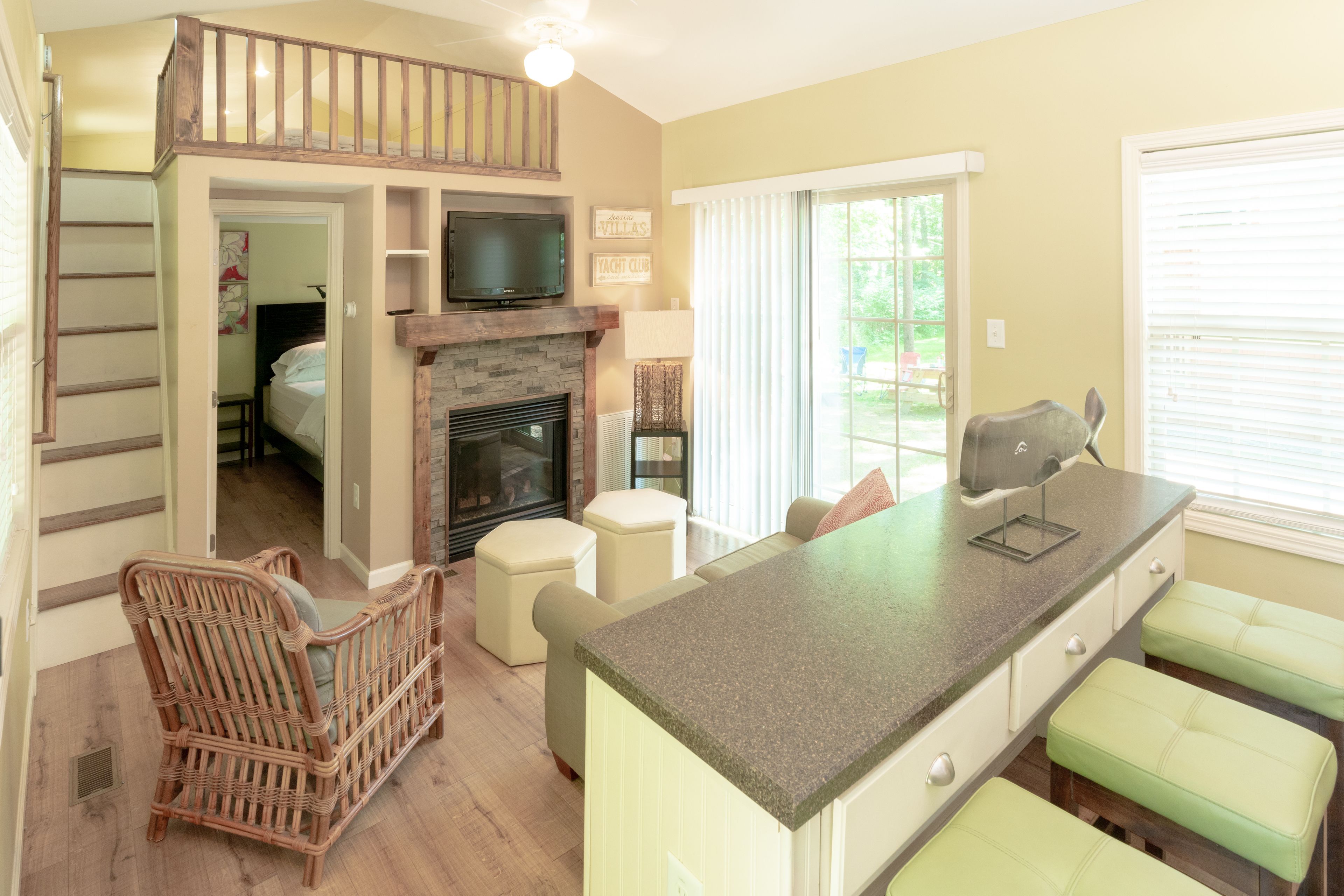 One Bedroom Cottage with Loft (Linens not provided) | Living area | Flat-screen TV