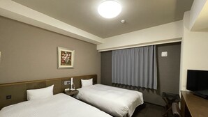 A hotel room with two beds, a desk, a television, a painting on the wall, and a window with curtains. - Hotel Route Inn Ina Inter (Minamiminowa)