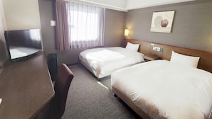 A hotel room with two beds, a desk, a chair, a TV, and a window with curtains. - Hotel Route Inn Komagane Inter (Komagane)