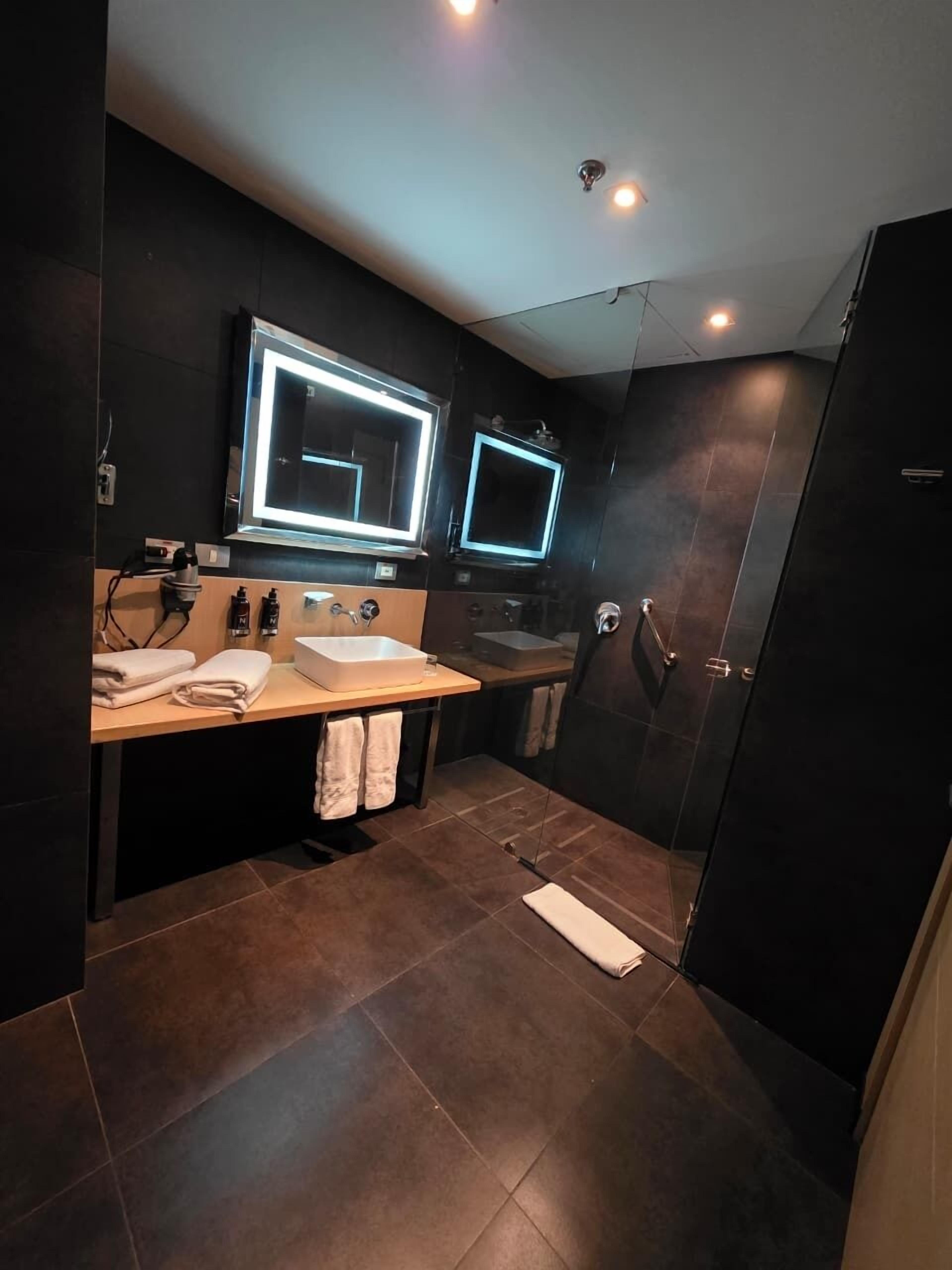 Shower, rainfall showerhead, designer toiletries, hair dryer