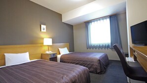 A hotel room with two beds, a desk, a chair, a TV, a lamp, and a window with curtains. - Hotel Route Inn Obihiro Ekimae (Obihiro)
