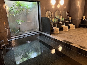 A modern bathroom with a large window, a small pool, and multiple sinks with soap dispensers. - Hotel Route - Inn Hirosaki-Joto (Hirosaki)