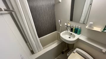 Combined shower/tub, free toiletries, hair dryer, slippers