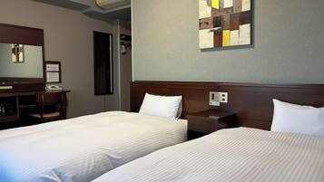 A hotel room with two beds, a desk, a chair, a nightstand, a wall-mounted artwork, and a mirror.