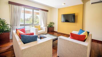 Premier Suite, 1 Bedroom, Garden View, Garden Area | Living area | 20-inch TV with satellite channels