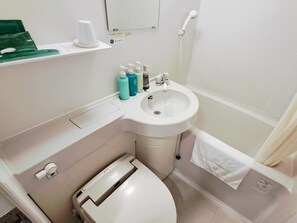Combined shower/tub, free toiletries, hair dryer, slippers