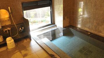 Combined shower/tub, free toiletries, hair dryer, slippers