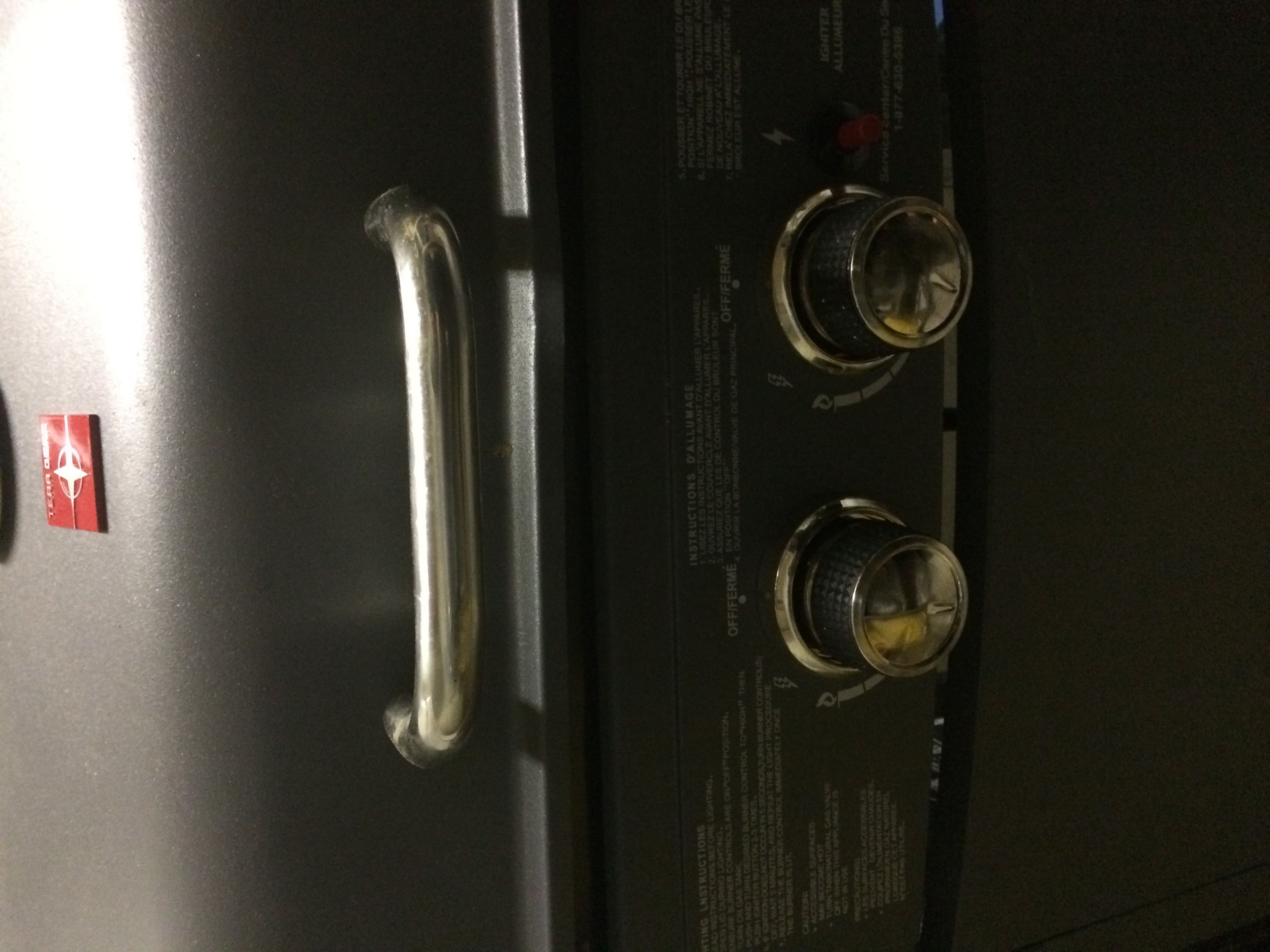 A black appliance with two dials and a silver handle.