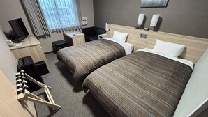 A hotel room with a large bed, a desk, a chair, a TV, and a window with curtains. - Hotel Route-Inn Court Fujioka (Fujioka)