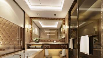 A luxurious bathroom with a large bathtub, a mirror, and a modern vanity.