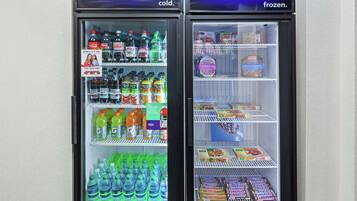 Two refrigerated display cases, one labeled 'cold' and the other 'frozen', containing various beverages and snacks.