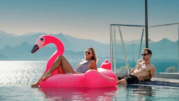 Outdoor pool, free pool cabanas, pool umbrellas