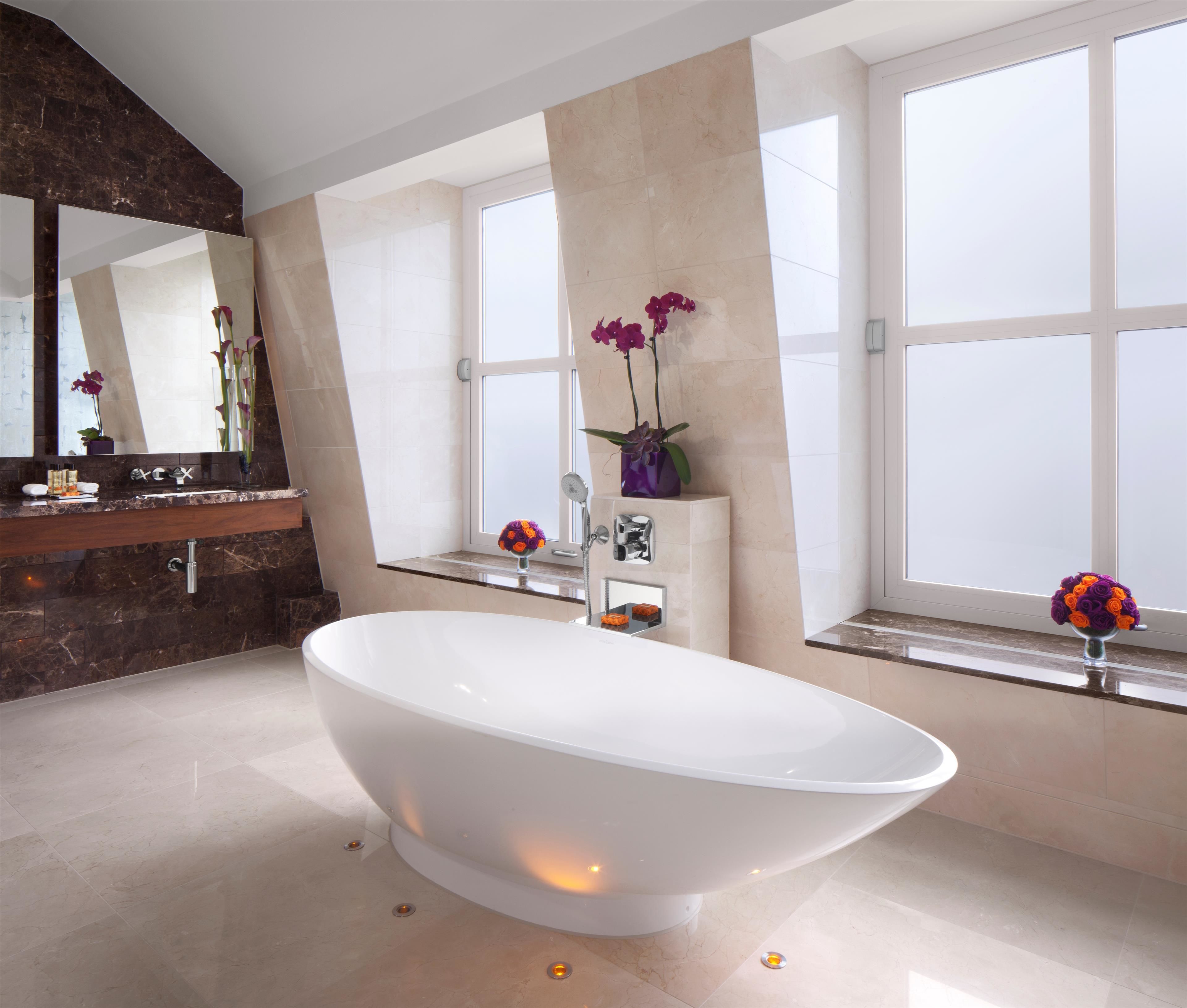 conrad suite | bathroom | combined shower/bathtub, free toiletries, hair dryer, bathrobes
