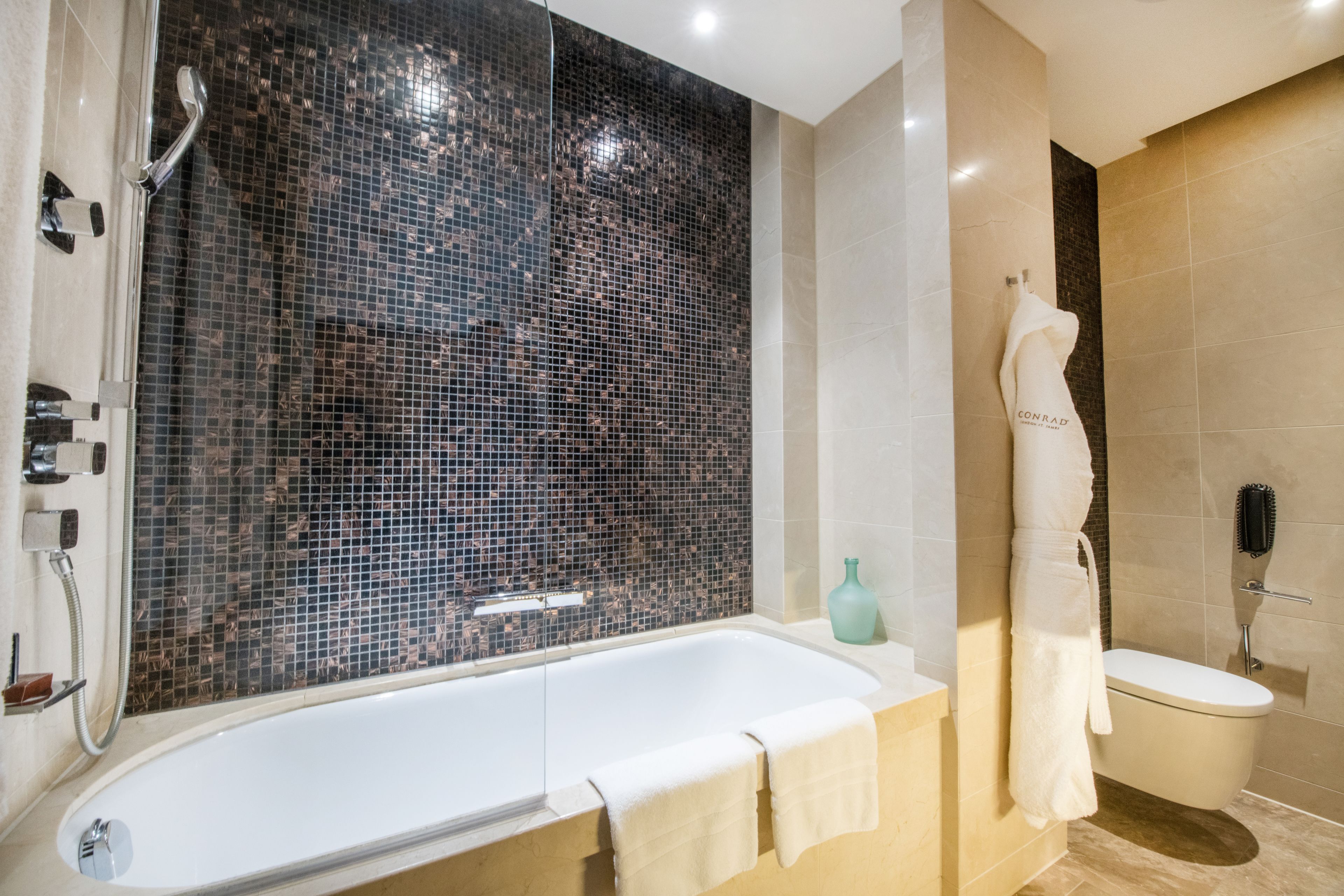one bedroom duplex suite | bathroom | combined shower/bathtub, free toiletries, hair dryer, bathrobes