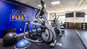 A gym with exercise equipment, a motivational wall, and a mirrored wall. - Holiday Inn Express Salinas by IHG (Salina)