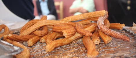 Churros on a wire rack.
