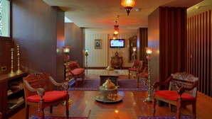 A traditional room with ornate furniture, a television, and decorative lighting. - Burckin Hotel (Istanbul)