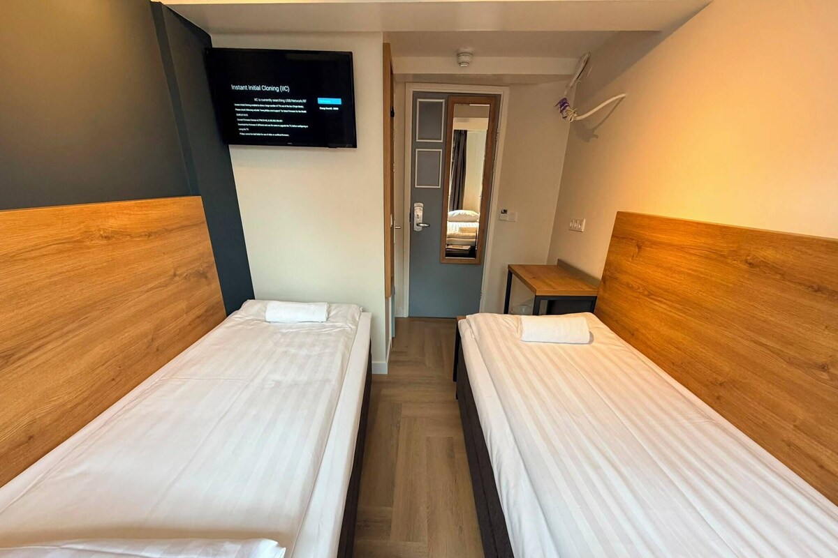 Standaard Twin kamer (Private Bathroom) | Een kluis op de kamer, gratis wifi, beddengoed