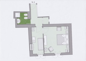 A floor plan of a hotel room with a bathroom, a small balcony, and a dining area.