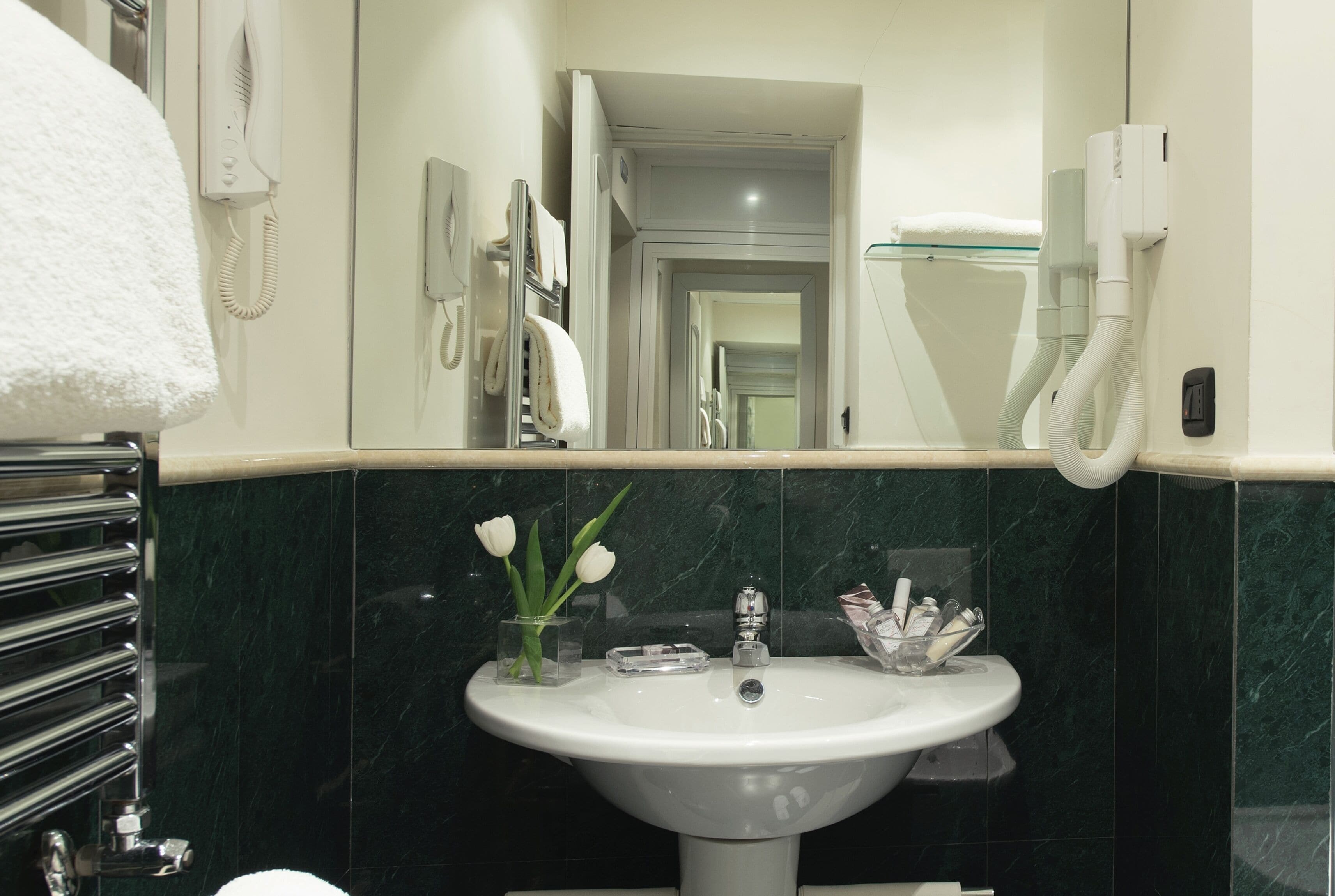 junior studio suite, city view, tower | bathroom | designer toiletries, hair dryer, slippers, bidet