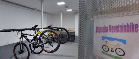 A bike parking area with a sign reading "Deposit Mountainbike".
