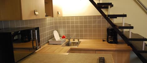 Full-size fridge, coffee/tea maker, cookware/dishes/utensils