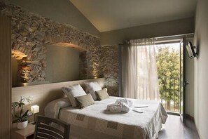 Hypo-allergenic bedding, down duvets, pillow-top beds, in-room safe