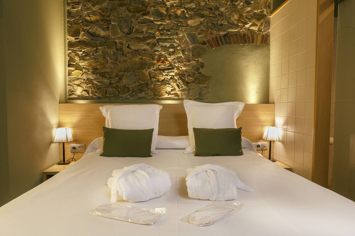 Hypo-allergenic bedding, down duvets, pillow-top beds, in-room safe