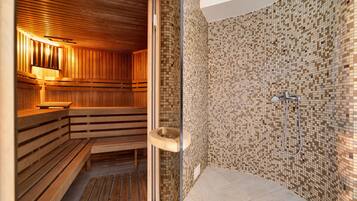 A sauna with wooden benches and a tiled wall.