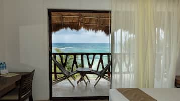 Sea View, 1 Queen Bed | Living area | 42-inch flat-screen TV with cable channels, TV