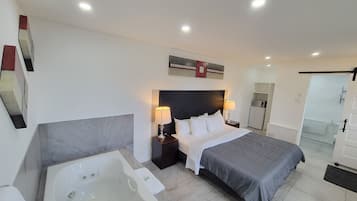 Standard Room, 1 King Bed, Jetted Tub, Ground Floor | 1 bedroom, desk, blackout drapes, free WiFi