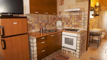 Fridge, stovetop, coffee/tea maker, cookware/dishes/utensils