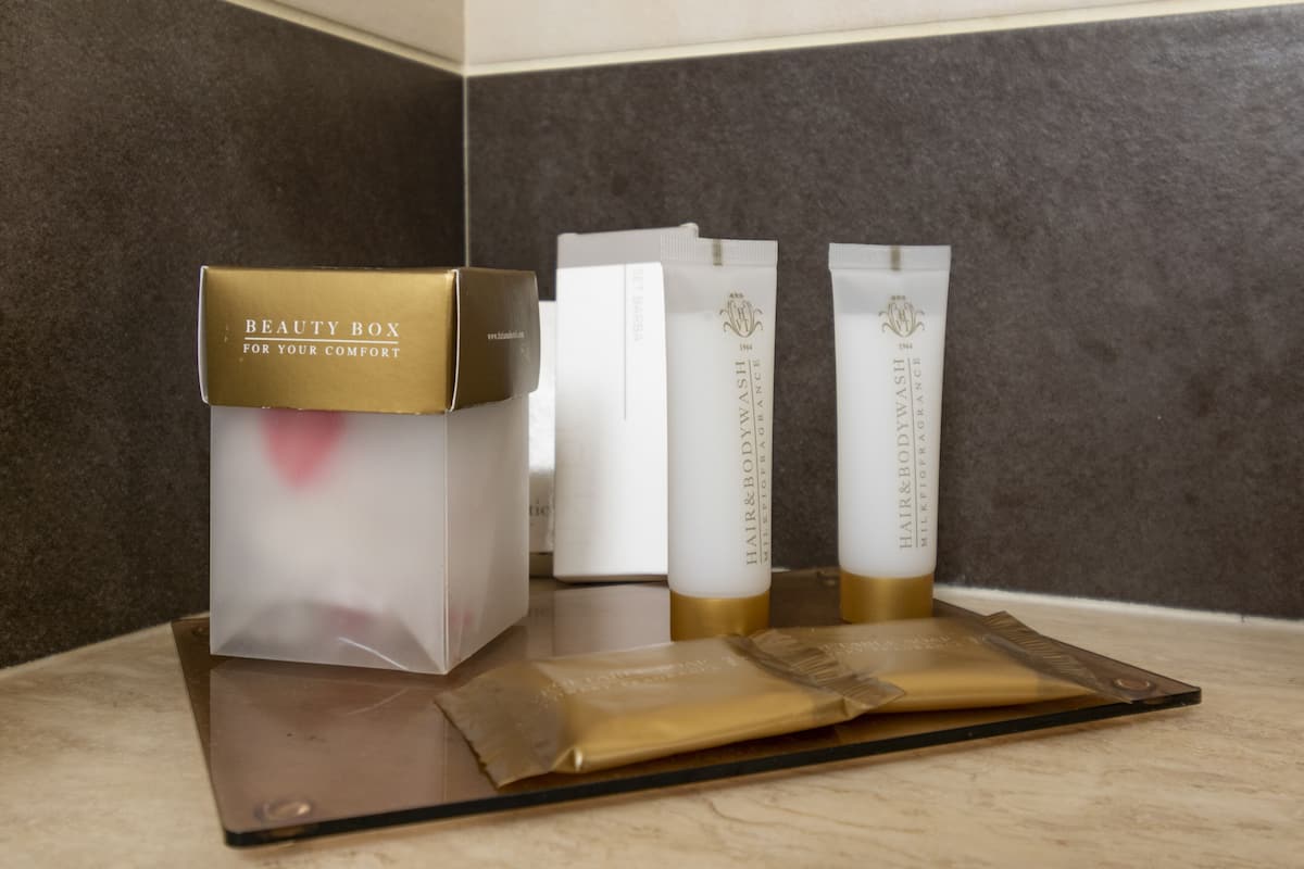 deluxe room, balcony | bathroom | shower, rainfall showerhead, designer toiletries, hair dryer