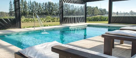 Indoor pool, outdoor pool, pool umbrellas, pool loungers