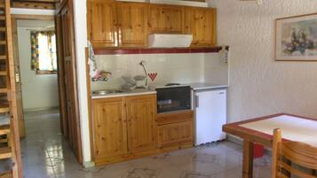 Family Cottage, 2 Bedrooms, Beach View | Private kitchen | Full-sized fridge, stovetop, coffee/tea maker, toaster