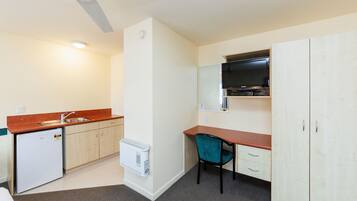 Standard Suite, 1 Bedroom, Non Smoking, Kitchen | Desk, laptop workspace, blackout drapes, iron/ironing board