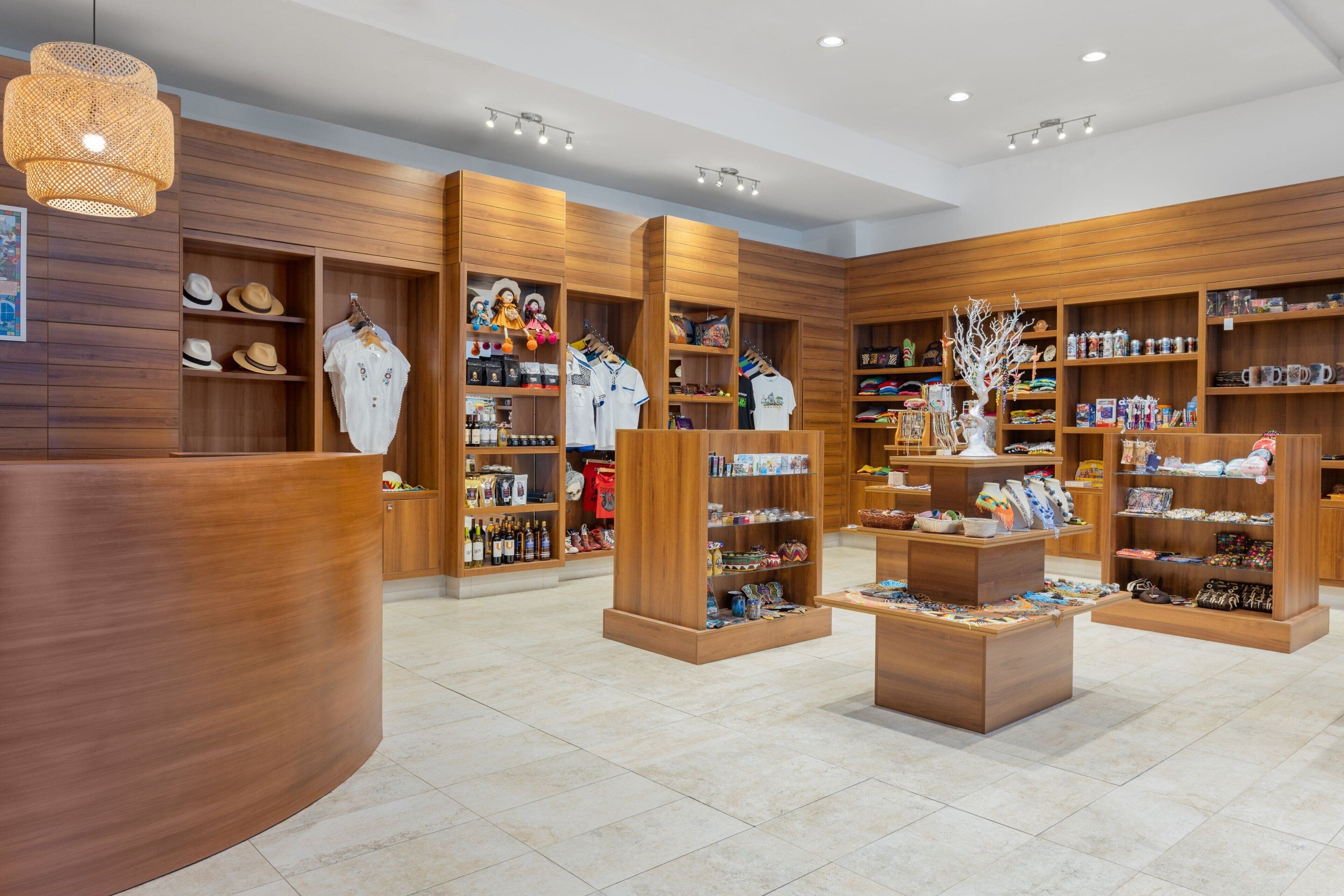 A well-organized store with wooden shelving and a curved reception desk.